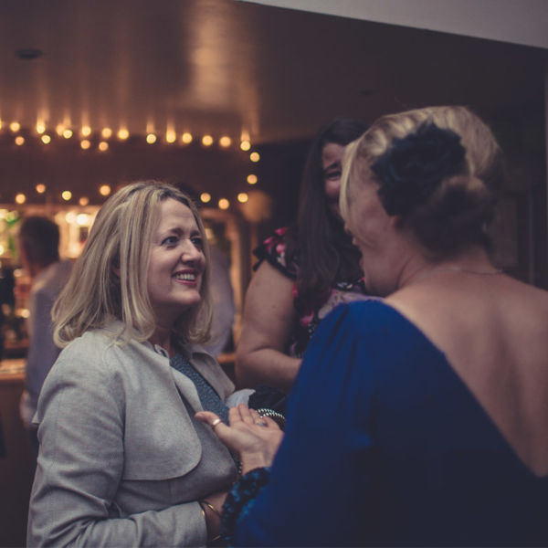 Party guests in bar area at KWMCC