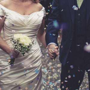 Wedding couple holding hands